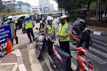 Ilustrasi polisi sedang melakukan Operasi Patuh Jaya di 16 lokasi